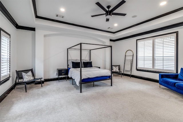 4518 Gilbert Ave, Dallas, TX 75219 - carpeted bedroom featuring a tray ceiling, crown molding, multiple windows, baseboards, and recessed lighting