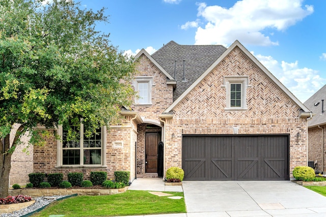 202 Woodland Pond Dr, Allen, TX 75013 - view of front of property featuring driveway, brick siding, a garage, and a front yard