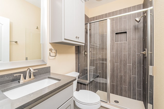 202 Woodland Pond Dr, Allen, TX 75013 - full bathroom featuring toilet, vanity, and a shower stall
