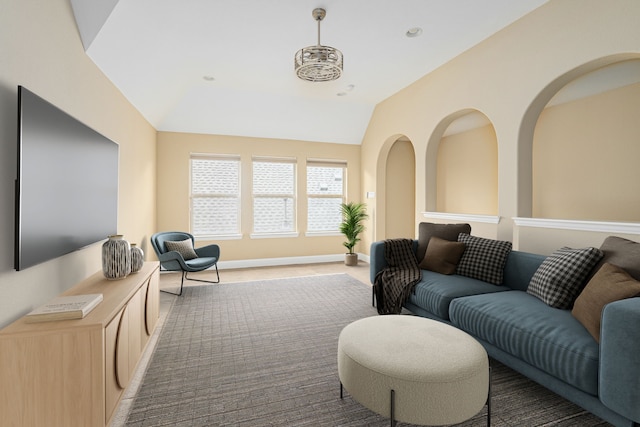 202 Woodland Pond Dr, Allen, TX 75013 - living room featuring vaulted ceiling and baseboards