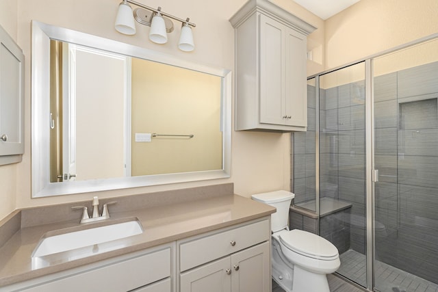 202 Woodland Pond Dr, Allen, TX 75013 - bathroom featuring toilet, vanity, and a stall shower