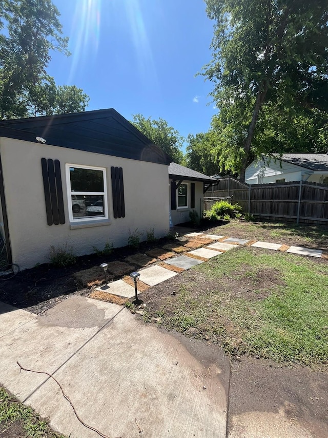 412 Sands Ct, White Settlement, TX 76108 - rear view of house featuring stucco siding