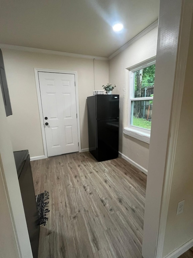 412 Sands Ct, White Settlement, TX 76108 - doorway to outside featuring ornamental molding, wood finished floors, and baseboards