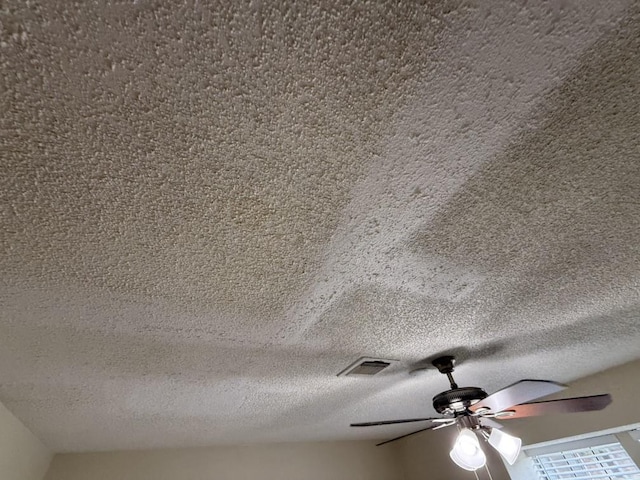 413 Creekwood Ln, Lewisville, TX 75067 - detailed view of a textured ceiling and ceiling fan