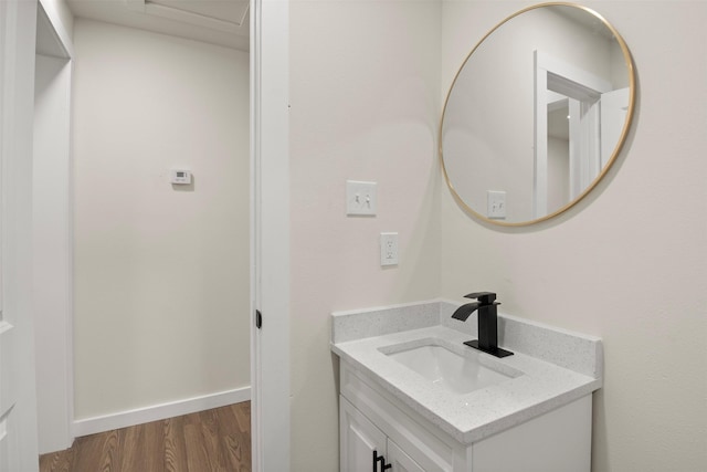 717 W Boyce Ave, Fort Worth, TX 76115 - bathroom featuring vanity, wood finished floors, and baseboards