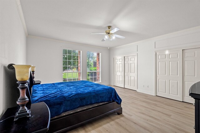 3936 Gillespie Dr, Carrollton, TX 75010 - bedroom featuring crown molding, multiple closets, light wood-type flooring, baseboards, and a ceiling fan