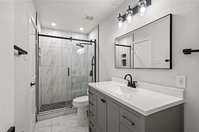 3936 Gillespie Dr, Carrollton, TX 75010 - bathroom with marble finish floors, toilet, vanity, a stall shower, and recessed lighting