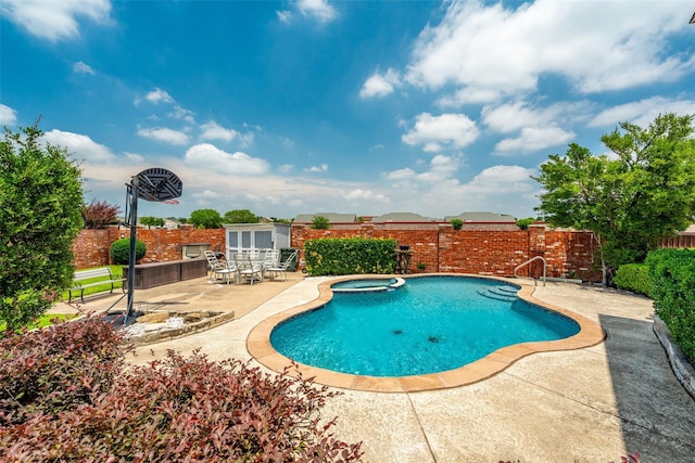 3936 Gillespie Dr, Carrollton, TX 75010 - view of swimming pool featuring a patio and a pool with connected hot tub