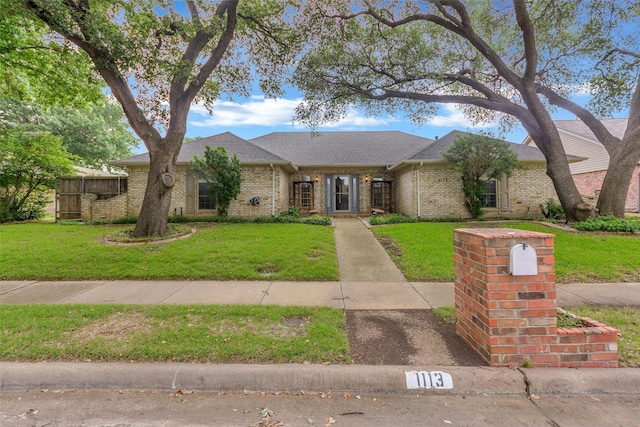 1113 Yorkshire Dr, Carrollton, TX 75007 - view of front of property featuring brick siding and a shingled roof