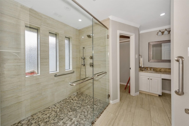1113 Yorkshire Dr, Carrollton, TX 75007 - bathroom with a stall shower, vanity, crown molding, baseboards, and recessed lighting