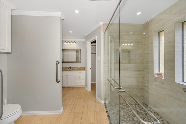 1113 Yorkshire Dr, Carrollton, TX 75007 - full bathroom with a stall shower, crown molding, vanity, baseboards, and toilet
