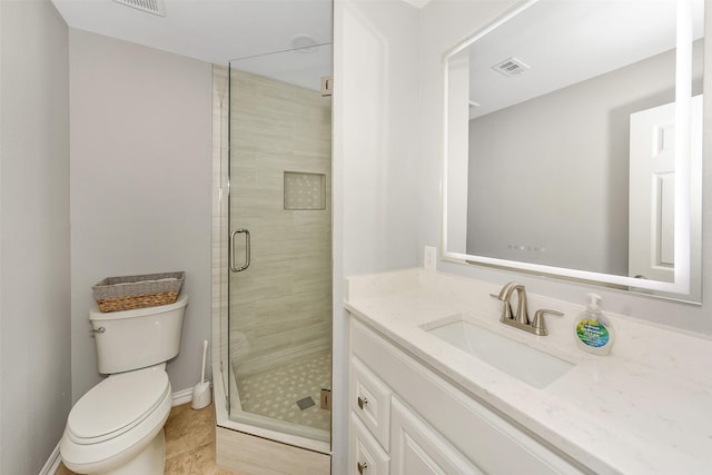1113 Yorkshire Dr, Carrollton, TX 75007 - full bath featuring vanity, toilet, a stall shower, baseboards, and tile patterned floors
