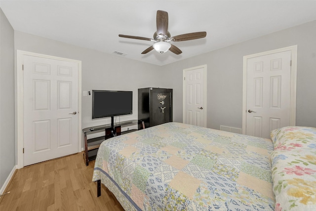 1113 Yorkshire Dr, Carrollton, TX 75007 - bedroom featuring light wood finished floors, baseboards, and ceiling fan