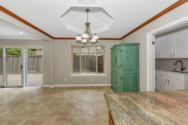 1113 Yorkshire Dr, Carrollton, TX 75007 - unfurnished dining area with a sink, a chandelier, baseboards, light tile patterned floors, and ornamental molding