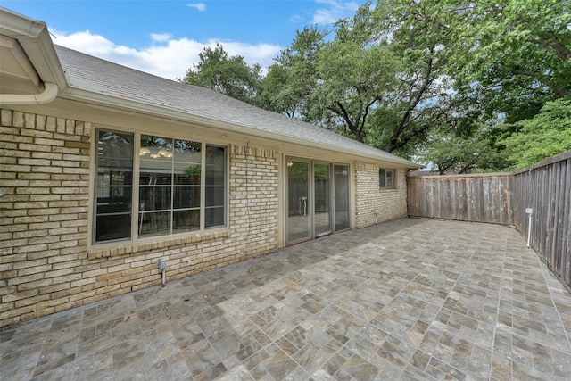 1113 Yorkshire Dr, Carrollton, TX 75007 - fenced backyard with a patio