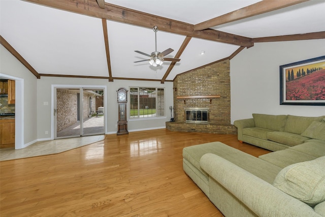1113 Yorkshire Dr, Carrollton, TX 75007 - living area featuring baseboards, ceiling fan, light wood-style flooring, and a fireplace