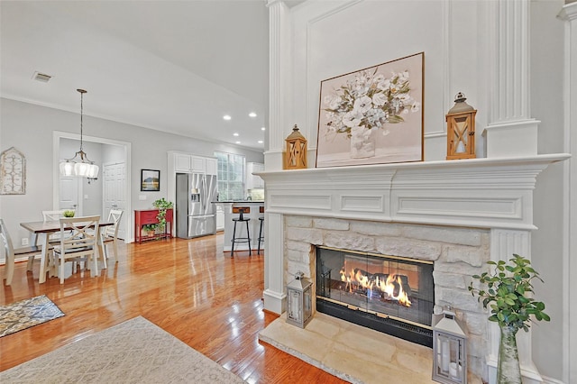 1403 Chelsea Cir, Southlake, TX 76092 - living room featuring light wood finished floors, a fireplace, recessed lighting, and crown molding