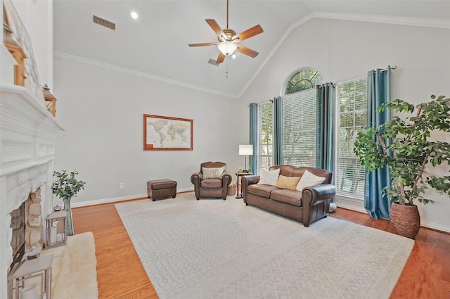 1403 Chelsea Cir, Southlake, TX 76092 - living area featuring a ceiling fan, wood finished floors, a stone fireplace, high vaulted ceiling, and baseboards
