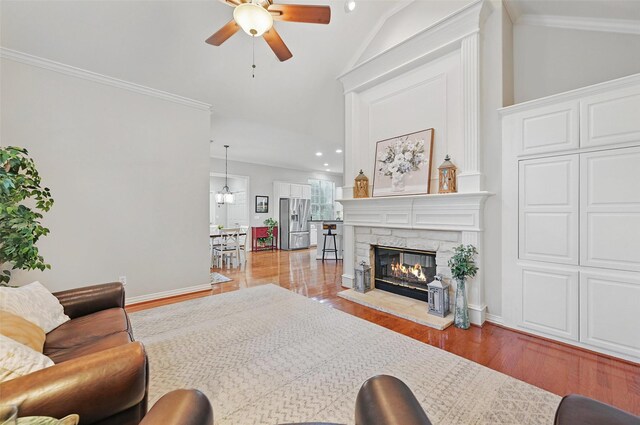1403 Chelsea Cir, Southlake, TX 76092 - living room featuring ceiling fan, wood finished floors, a fireplace, baseboards, and ornamental molding