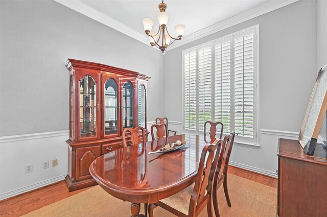 1403 Chelsea Cir, Southlake, TX 76092 - dining space featuring a chandelier, wood finished floors, ornamental molding, and baseboards