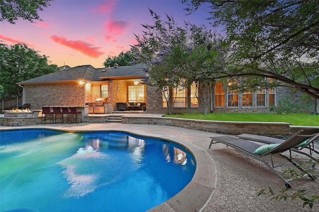 1403 Chelsea Cir, Southlake, TX 76092 - view of swimming pool featuring a patio and an outdoor fire pit