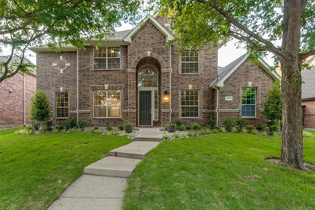 14548 Blakehill Dr, Frisco, TX 75035 - traditional-style house with a front lawn and brick siding