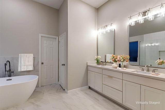 14548 Blakehill Dr, Frisco, TX 75035 - full bathroom with double vanity, a freestanding tub, marble look tile flooring, and a high ceiling