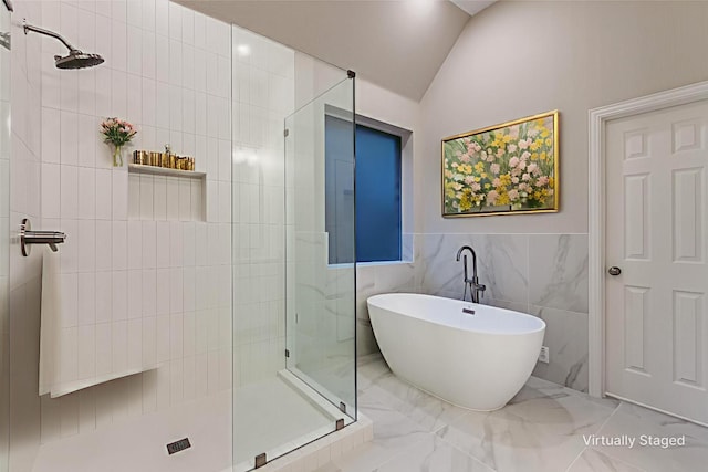 14548 Blakehill Dr, Frisco, TX 75035 - bathroom with tiled shower, tile walls, a freestanding bath, marble finish flooring, and vaulted ceiling