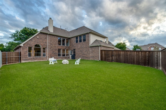 14548 Blakehill Dr, Frisco, TX 75035 - back of property with a chimney and brick siding