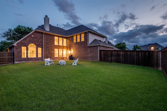 14548 Blakehill Dr, Frisco, TX 75035 - back of house with a chimney and brick siding