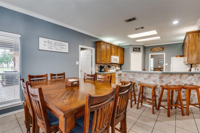4811 Jakes Way, Midlothian, TX 76065 - dining area featuring light tile patterned flooring and crown molding
