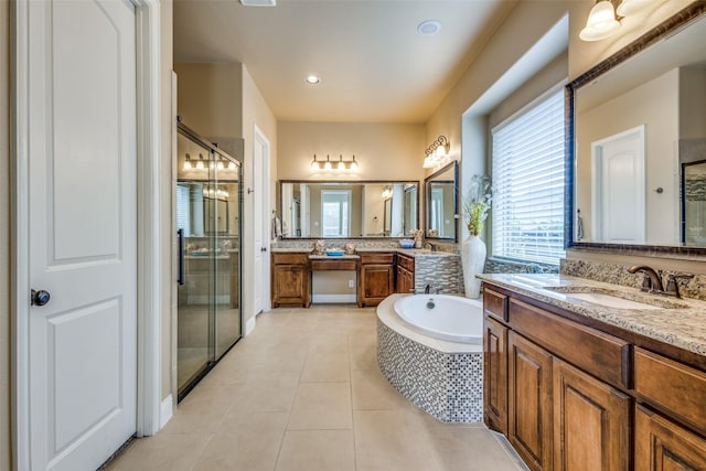5014 Toledo Bend Dr, Frisco, TX 75033 - bathroom with a shower stall, two vanities, tile patterned floors, and a garden tub