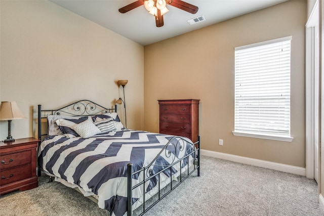 5014 Toledo Bend Dr, Frisco, TX 75033 - carpeted bedroom featuring multiple windows and a ceiling fan