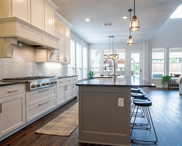 2624 Seabiscuit Rd, Celina, TX 75009 - kitchen featuring stainless steel gas cooktop, dark wood-style flooring, backsplash, healthy amount of natural light, and recessed lighting
