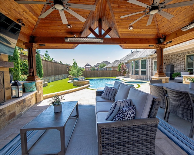 2624 Seabiscuit Rd, Celina, TX 75009 - fenced backyard with a gazebo, a ceiling fan, an outdoor hangout area, and a patio