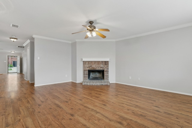 1812 Elk Lake Trl, Justin, TX 76247 - unfurnished living room with crown molding, a ceiling fan, wood finished floors, a fireplace, and baseboards
