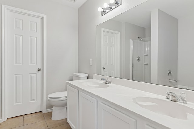 1812 Elk Lake Trl, Justin, TX 76247 - bathroom with a shower, tile patterned flooring, double vanity, and toilet