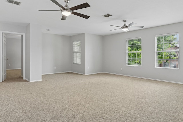 1812 Elk Lake Trl, Justin, TX 76247 - unfurnished room featuring ceiling fan, light colored carpet, plenty of natural light, and baseboards