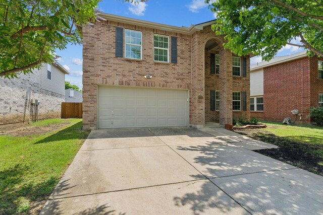 1812 Elk Lake Trl, Justin, TX 76247 - traditional-style home with driveway, an attached garage, and brick siding