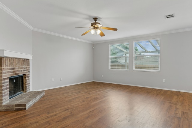 1812 Elk Lake Trl, Justin, TX 76247 - unfurnished living room featuring a ceiling fan, ornamental molding, wood finished floors, baseboards, and a brick fireplace