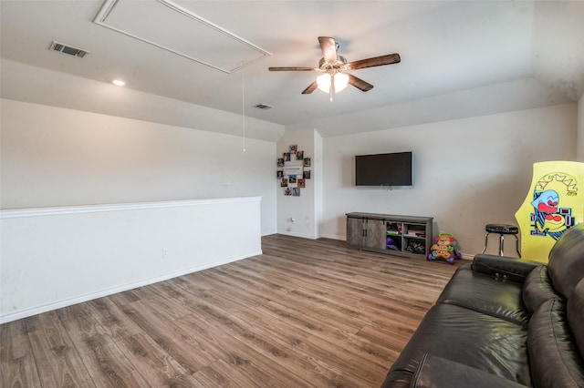 1601 Pecan Orchard Dr, Princeton, TX 75407 - living area with attic access, wood finished floors, a ceiling fan, baseboards, and vaulted ceiling