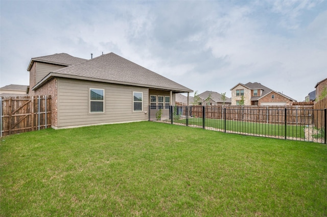 1601 Pecan Orchard Dr, Princeton, TX 75407 - back of house with roof with shingles and brick siding