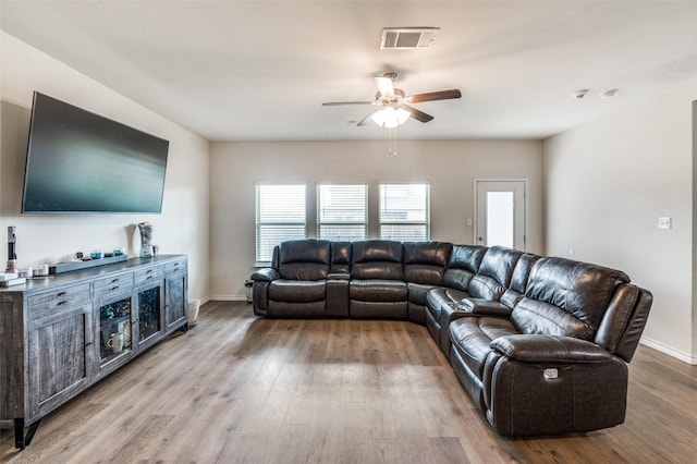 1601 Pecan Orchard Dr, Princeton, TX 75407 - living area featuring ceiling fan, wood finished floors, and baseboards