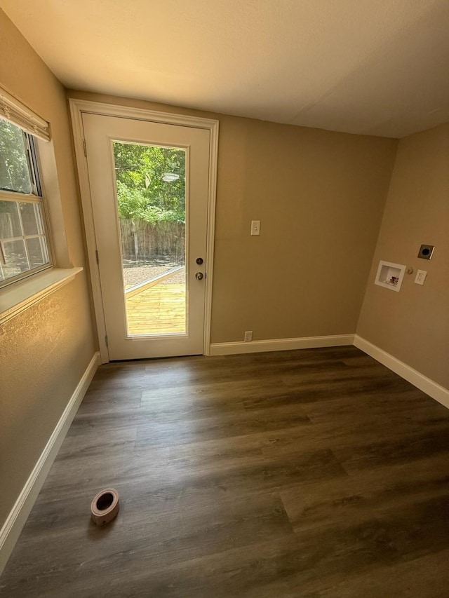 602 Pierson St, Lancaster, TX 75146 - doorway to outside featuring dark wood-type flooring and baseboards