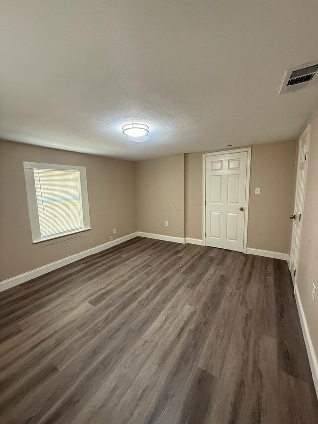 602 Pierson St, Lancaster, TX 75146 - unfurnished room featuring dark wood-style floors and baseboards