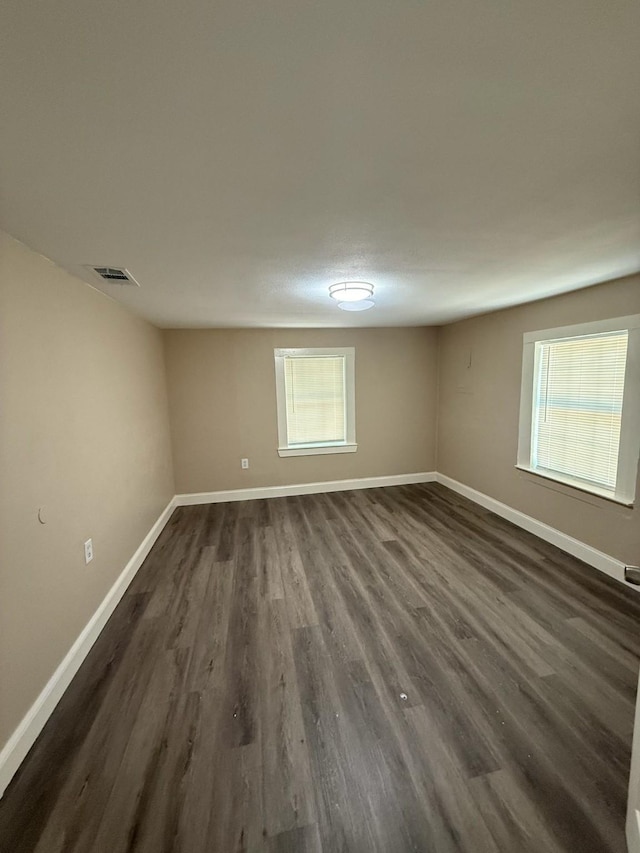 602 Pierson St, Lancaster, TX 75146 - empty room featuring baseboards and dark wood finished floors