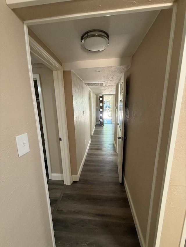 602 Pierson St, Lancaster, TX 75146 - corridor with dark wood-style floors and baseboards