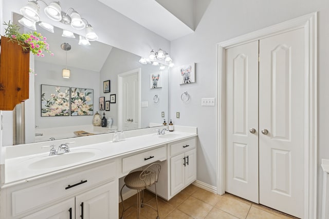 816 Claycourt Cir, Fort Worth, TX 76120 - full bathroom featuring tile patterned flooring, double vanity, lofted ceiling, and baseboards