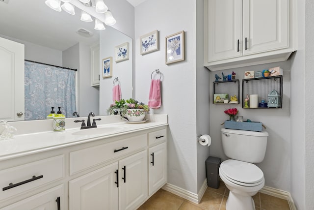 816 Claycourt Cir, Fort Worth, TX 76120 - bathroom with vanity, toilet, tile patterned flooring, and baseboards