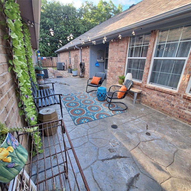 816 Claycourt Cir, Fort Worth, TX 76120 - fenced backyard with a patio area and central AC unit